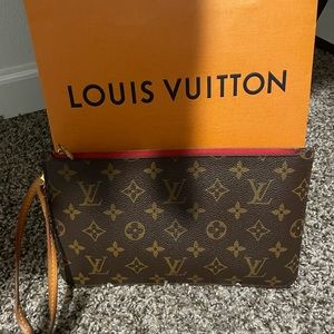 LV Wristlet or can be worn as clutch.